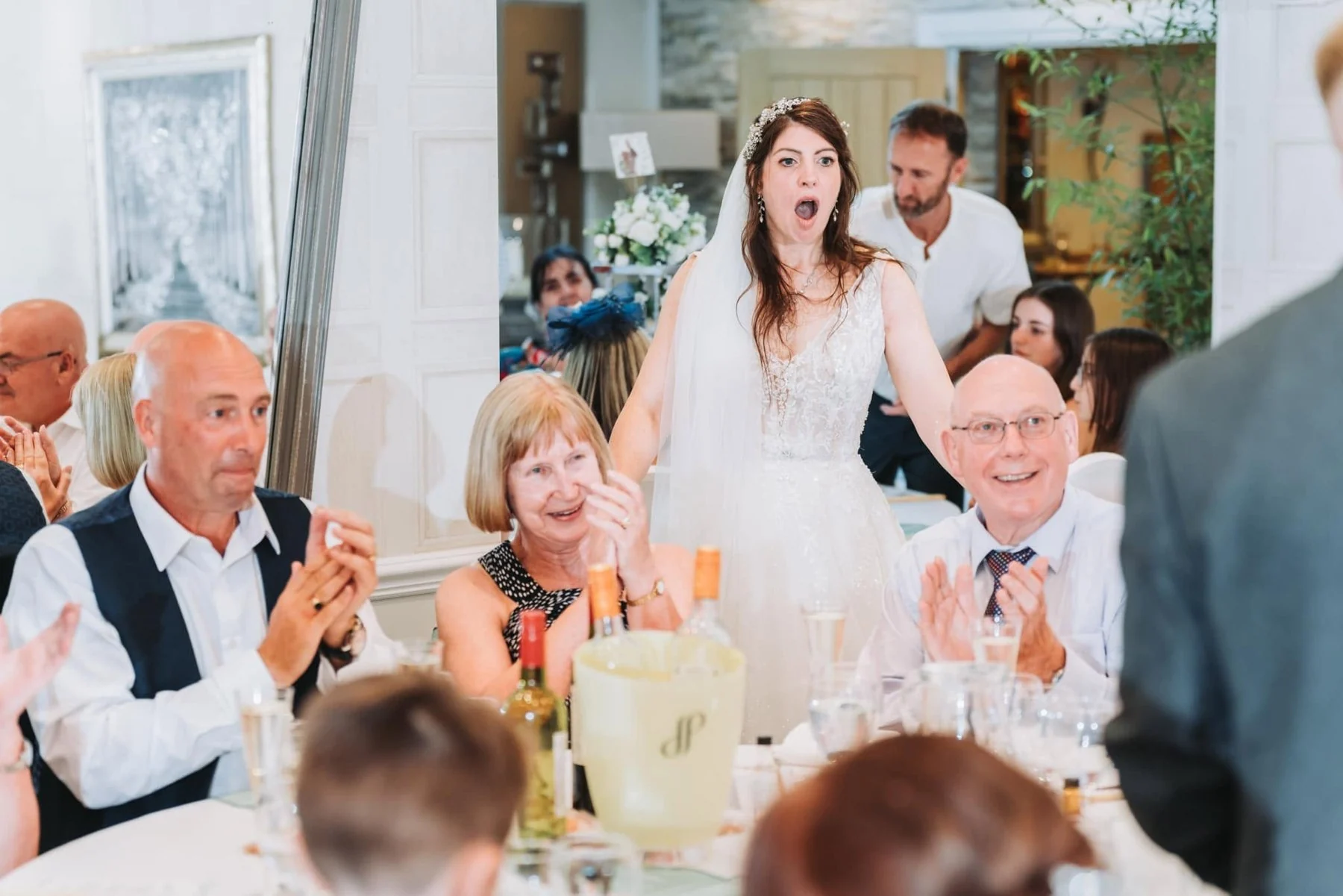 A bride reacting with surprise to Ben’s close-up magic